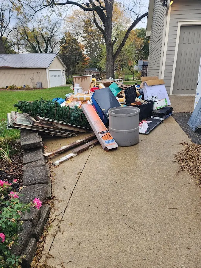 Dumpster being loaded with debris for Residential Dumpster Rental in Tulia